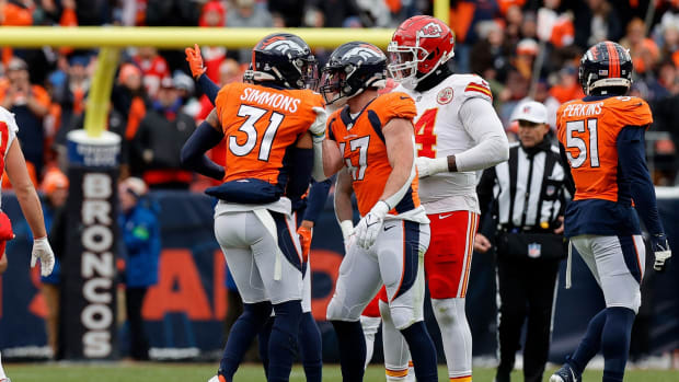 Oct 29, 2023; Denver, Colorado, USA; Denver Broncos safety Justin Simmons (31) celebrates his fumble recovery with linebacker Josey Jewell (47) in the second quarter against the Kansas City Chiefs at Empower Field at Mile High.